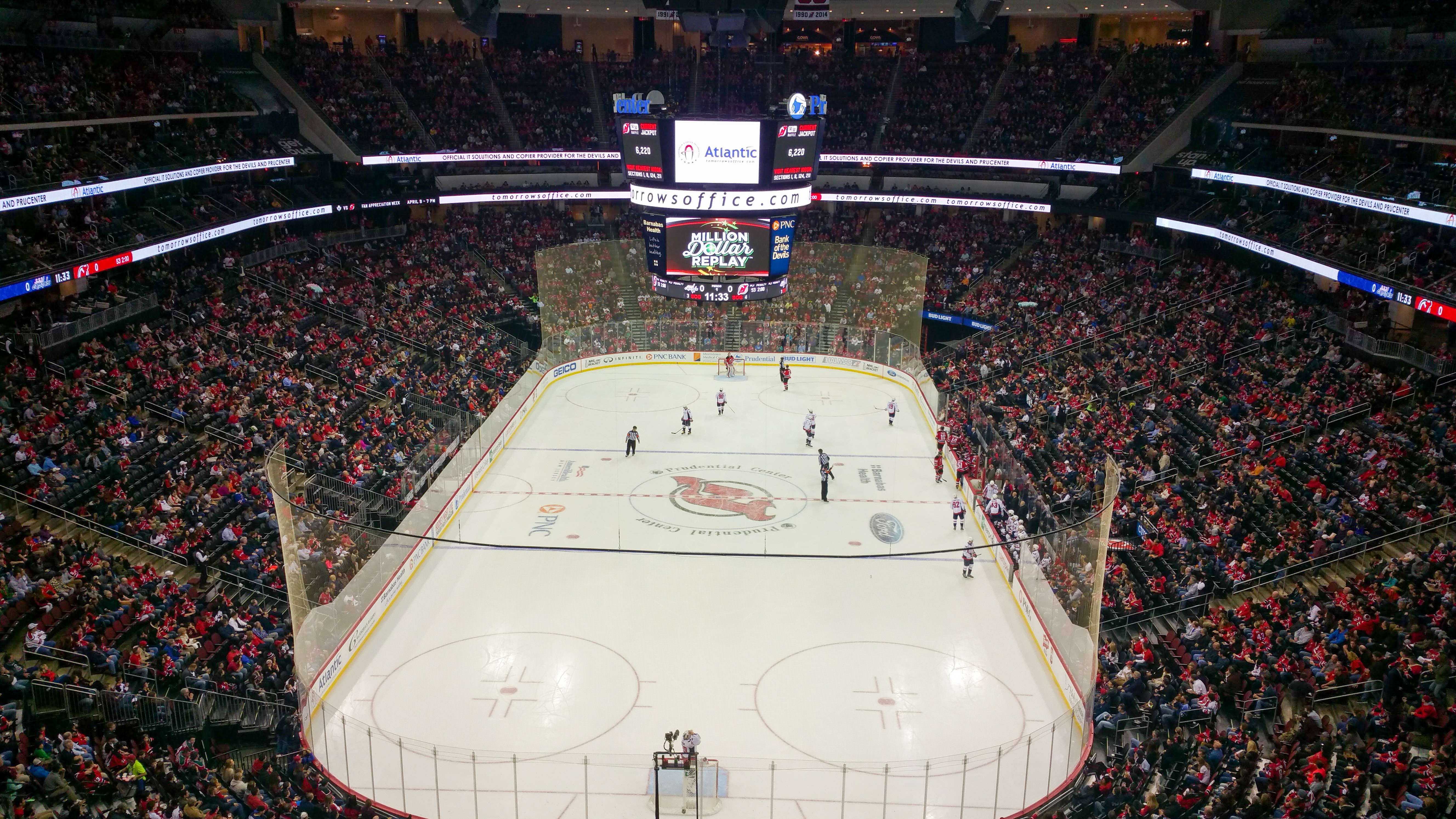 A picture of the interior of the Prudential Center during a Devil game in 2016 with the old videoboard.